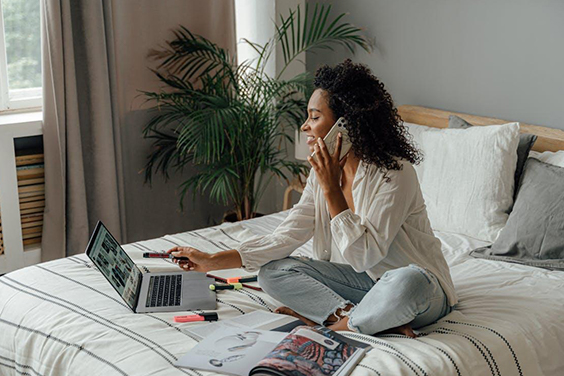 Woman sitting on bed